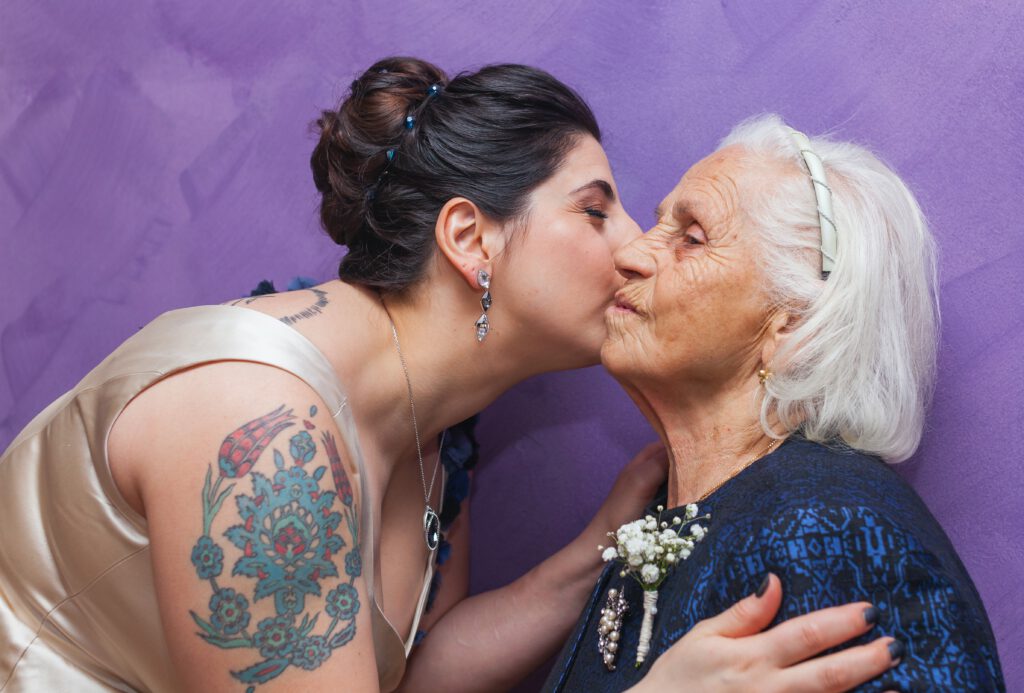 International Women's Day: Woman kissing an older woman